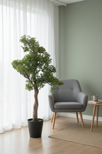 Veštački bonsai 120 cm pored sive fotelje i prozora